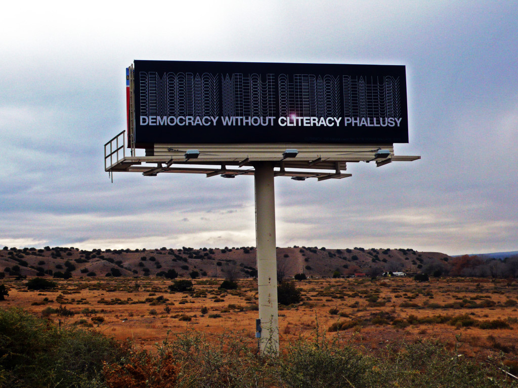 CLITERACY, 100 Natural Laws Billboard in Santa Fe, 2013 (Sophia Wallace)