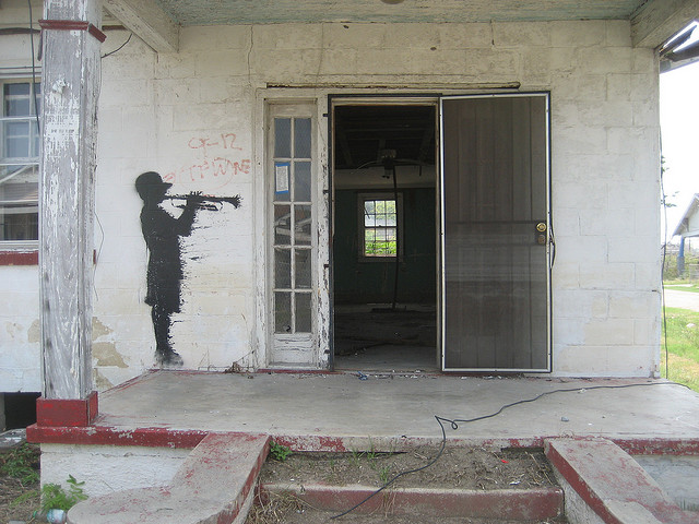 House with Banksy work, Upper Ninth Ward, New Orleans. Image: Infrogmation of New Orleans/Flickr